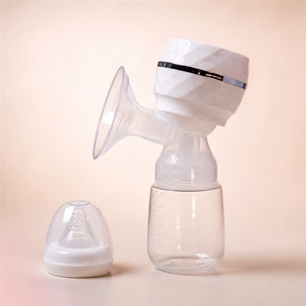 Tire-lait électrique blanc, biberon et tétine